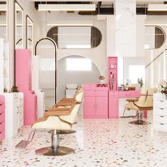 a pink and white salon with lots of chairs in front of the counter top area