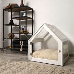 there is a dog house bed in the room