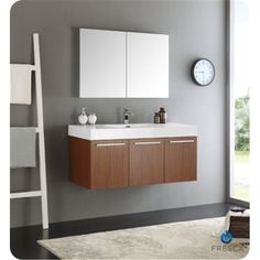 a bathroom vanity with two mirrors and a ladder in front of the sink is shown