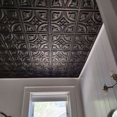 the ceiling in this bathroom is painted black