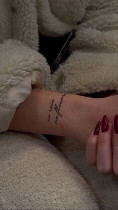 a woman's arm with a tattoo that reads, i love you to the moon and back