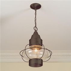 an old fashioned light fixture hanging from the ceiling