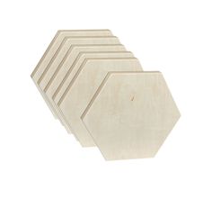 four unfinished wooden hexagons sitting on top of each other