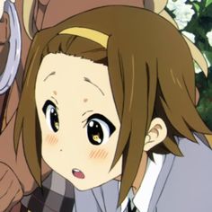 an anime character with brown hair and big eyes