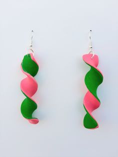 Elevate your retro style game with our unique Bright Pink and Cyber Green Spiral Polymer Clay Earrings, exclusively designed by Meraki Made. These vibrant and lightweight swirl statement earrings are meticulously handcrafted in the USA and perfect for any occasion. Add a pop of neon color and personality to your outfit and get noticed with these mesmerizing retro 80's earrings! Have a decades themed party to attend? These would be excellent unique costume jewelry for that occasion as well! *Each pair of earrings is handmade so slight variations may occur. Want to see more Retro Styles? Click here! https://www.etsy.com/shop/MerakiMadeClay?ref=seller-platform-mcnav&section_id=42289890 Check out more Meraki Made styles here! https://www.etsy.com/shop/MerakiMadeClay Green Polymer Clay Earrings, 80's Costume, 80s Earrings, Unique Costumes, Clay Jewelry Diy, Neon Color, Retro Stil, Polymer Clay Jewelry, Themed Party