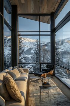 a living room filled with furniture next to a large window covered in frosty snow