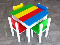 three children's table and chairs made out of lego blocks