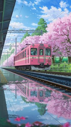 a pink train traveling down tracks next to a lush green field and tree filled with flowers