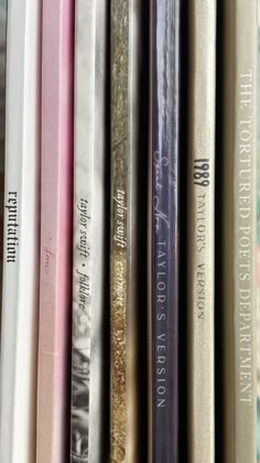 a row of books sitting on top of a shelf