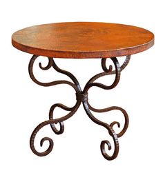 a wooden table with wrought iron legs and a round top on an isolated white background