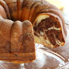 a bundt cake that has been cut in half and is on a glass plate