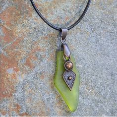 Beautiful Green Sea Glass & Leather Pendant Necklace! Accessorize Your Free-Flowing Look With This Pendant Necklace Adorned By Sea Glass In A Lush Hue For A Boho Flair. Details: *Chain: 18'' L With 2'' Extender *Pendant: 0.5'' W X 1.75'' L *Lobster Claw Clasp *Alloy / Glass / Leather *Imported *Great Gift Idea!* Tulip Necklace, Filigree Pendant Necklace, Leather Pendant, Diy Necklaces, Blue Beaded Necklace, Necklace Ideas, Filigree Pendant, Beaded Pendant Necklace, Sea Glass Necklace