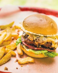 a hamburger and french fries on a tray