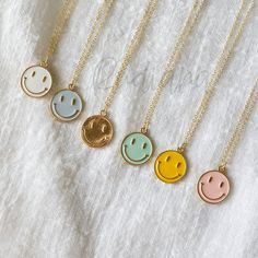 "Beautiful and lovely happy face charm necklace. Made of gold smiley face charm with skinny gold plated brass chain. Soft and warm. Great for gift , everyday or special occasion. Your item will ship in a gift box. Please feel free to contact me if you have any question. ♥ Length 14\" -20\" chain ♥ Charm 5/8\" x 3/4\" ♥ Gold plated over brass ♥ Delivery Time Fast shipping within 1 - 3 days ♥ See more Rudiana Accessories Rudiana.etsy.com" Gold Smiley Face Necklace, Popular Necklaces For Teens, Smile Face Necklace, Smiley Face Jewelry, Cute Gold Necklace, Smile Jewelry, Pretzel Necklace, Smiley Face Necklace, Prom Necklaces