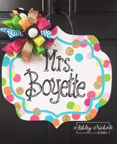 a door hanger that says, mrs boyette