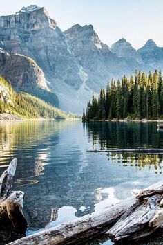 a mountain lake surrounded by trees and mountains