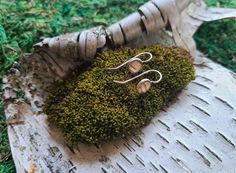 Genuine White Birch Bark Earrings from the forests of Northern Ontario Canada. Always ethically sourced & infused with the healing energy of the forest. Tiny 6.1mm birch bark dangle earrings. Eco-friendly genuine white birch bark earrings, .999 antiqued silver-plated, topped with clear resin. The ear wires are nickel-free surgical steel. All of the bark used in our jewellery is ethically sourced and not harvested from live trees. The white birch we used comes from Northern Ontario Canada, and carries within it, the energy of our Great Canadian Wilderness. Birch Bark Earrings, Birch Jewelry, Canadian Wilderness, Northern Ontario, Live Tree, White Birch, Birch Bark, Healing Energy, Leaf Necklace