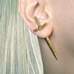 These Celtic Sword Earrings bring a unique look to any style. They are made of stainless steel, making them durable and perfect for everyday wear. The viking-style design gives a powerful statement look. Sold as SINGLE or PAIR Material : 316 Stainless steel Post: 0.9mm thick, 6mm long Size: 53 mm longed to edge. Blade:31 mm long Closure: Screw back Ships in a gift box Listing for sword earring only, cuff is not included Dagger Earrings, Edgy Earrings, Celtic Earrings, Dragon Earrings, Gothic Vintage, Ear Jacket Earring, Gothic Earrings, Steel Post, Viking Jewelry