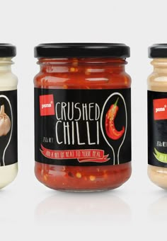 three jars of crushed chilli next to each other