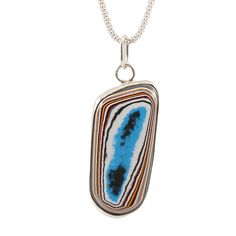 Handmade Fordite necklace Stunning Fordite piece set in sterling silver, open back step bezel. Fordite dates back to the 1920's when layers upon layers of paint would build up in the bays, eventually needing to be removed. Someone discovered that the dried up paint layers could be cut and polished just like gemstones, resulting in unique colors and patterns, creating stunning one-of-a-kind pieces. Most of the Fordite used today is from the 60's to late 70's since the 1980's is when car manufactu Unique Sterling Silver Necklace With Rectangular Pendant, Sterling Silver Gemstone Necklace For Collectors, Artistic Sterling Silver Necklace With Oval Pendant, Artistic Oval Sterling Silver Necklace, Artistic Oval Sterling Silver Necklaces, Artistic Sterling Silver Necklace, Sterling Silver Gemstone Necklace, Back Steps, Colors And Patterns