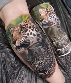 a man's arm with a tattoo on it that has a leopard in the middle