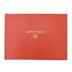 a red book with the words happy place written on it