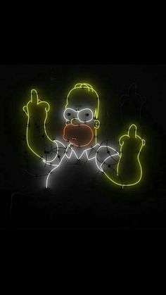 the simpsons neon sign is lit up with yellow and green lights, while he appears to be pointing at something