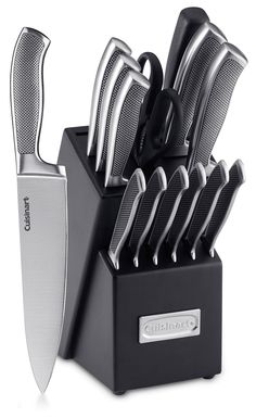 a knife holder with knives in it on top of a white background and black handles