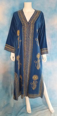 "This incredible velvet gold and silver embroidered robe is, I am pretty darn sure, a Turkish wedding robe - a Bindalli. Made of luxuriant cobalt/cerulean blue short-pile cotton velvet, featuring dival embroidery (like couching) in elaborate floral and scrollwork designs. Loose kimono-like sleeves and long slits up the sides.  It fastens up the front with small snaps. These days, robes like this seem to be worn over a woman's wedding dress in Turkey, for traditional Turkish wedding attire. This Royal Ceremonial Traditional Wear With Zari Work, Royal Traditional Wear With Zari Work For Ceremonial Occasions, Ceremonial Traditional Wear With Zari Work, Royal Ceremonial Traditional Wear For Eid, Royal Traditional Wear For Eid Ceremonial, Royal Traditional Wear For Eid Ceremonies, Gold Bohemian Kaftan For Wedding, Royal Embroidered Traditional Wear For Ceremonial Occasion, Royal Embroidered Kaftan For Wedding