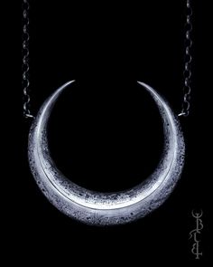 In honour of Artemis, Goddess of the wilds and Goddess of the moon. She who wears the crescent moon crown. This necklace features a large faceted crescent moon, uniquely textured with lunar craters and crosshatched markings giving it the appearance of an ancient relic. The necklace is produced entirely in sterling silver which is treated with a dark patina then brightly polished to highlight the depth of all the intricate details.  The necklace hangs from a thick belcher chain and is available i Celestial Crescent Engraved Jewelry, Crescent Sun And Moon Festival Jewelry, Festival Crescent Jewelry With Sun And Moon Design, Festival Crescent Sun And Moon Jewelry, Symbolic Crescent Jewelry For Festival, Spiritual Hand-forged Crescent Jewelry, Mystical Crescent Jewelry With Sun And Moon Design, Symbolic Crescent Moon Phase Necklace, Mystical Crescent Sun And Moon Jewelry