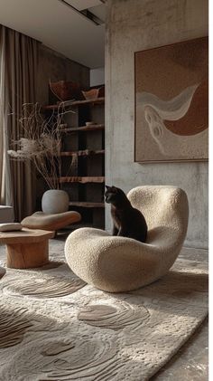 a cat sitting on top of a chair in a living room