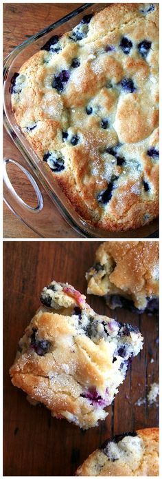 blueberry cobbler in a glass baking dish with one slice cut out and the other half eaten