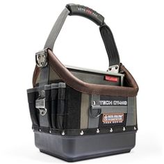 the tool bag is made out of canvas and has multiple compartments for tools to carry