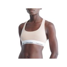 A Calvin Klein icon, crafted in a natural color palette. Designed with the original Calvin Klein logo band, this women's bralette is a sporty look that will leave you feeling sexy everyday. A Calvin Klein icon, crafted in a natural color palette. Designed with the original Calvin Klein logo band, this women's bralette is a sporty look that will leave you feeling sexy everyday.Click on this INTIMATES & SLEEPWEAR Guide to find the perfect fit and more! Wireless Racerback Soft, flexible Calvin Klei Calvin Klein Fitted Sports Bra For Athleisure, Calvin Klein Fitted Athleisure Sports Bra, Calvin Klein Spring Everyday Tops, Calvin Klein Spring Tops For Everyday Wear, Calvin Klein Sporty Medium Support Sports Bra, Calvin Klein Fitted Sports Bra, Calvin Klein Sporty Fitted Sports Bra, Fitted Calvin Klein Athleisure Tops, Calvin Klein Athleisure Tops For Sports