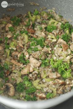 broccoli and mushrooms cooking in a pan on the stove top, with seasoning