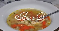 a white bowl filled with soup on top of a table