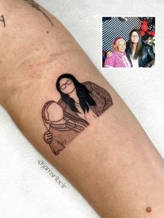 a woman's arm with a drawing of a girl and her mother on it