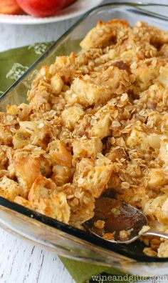 a glass casserole dish filled with oatmeal and apple pie topping