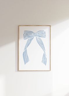 a white wall with a blue bow on it