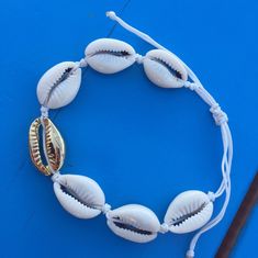 This beautiful nautical bracelet is hand made with Cowrie seashell. cowrie sea shell bracelet white cord roope silver plated sea shell naturel cowrie shells All my jewelery is hand crafted with pure and 925 sterling silver , this is a safe way for you to store necklace will be sent along with a beautiful gift box and pouch Anklets Beach, Nautical Bracelet, Beautiful Anklet, Mermaid Bracelet, Beach Anklets, Gold Anklet, Shell Bracelet, Cowrie Shell, Ankle Bracelet