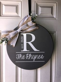 a door hanger with the letter r on it that says, the rhynes