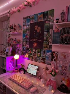 a desk with a keyboard, mouse and monitor on it in a room filled with toys