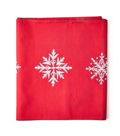 a red napkin with white snowflakes on it