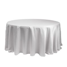 a round table with white cloth on it