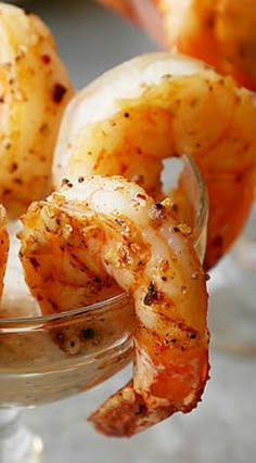 some shrimp in a small glass bowl on a table