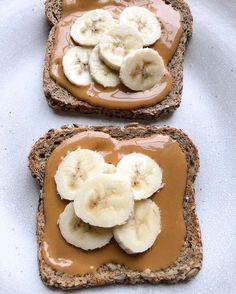 two slices of bread with peanut butter and bananas on them