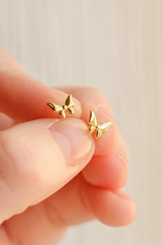 Yes, yes, yes!!! This tiny butterfly stud is made with 18k gold plated 925 sterling silver and is the HIGHEST quality, so it is completely safe for even the most sensitive ears. This stud is great for all ages, has stunning details, and is such a staple piece! This stud is also extremely tarnish resistant and so feminine and dainty! This stud is .25 inch in length. Floral Stud Earrings, Tiny Gold Jewelry, Gold Earrings For Gift, Small Gold Earrings Designs, Gold Studs Earrings Indian, Cute Earrings Aesthetic, Gold Earrings Studs Simple, Delicate Gold Earrings, Ear Studs Design