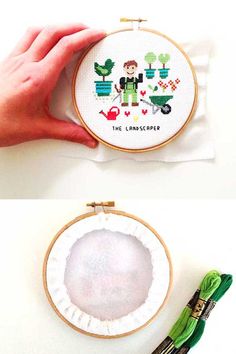 someone is holding up a cross - stitch pattern to make it look like they are working on