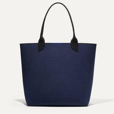 Your everyday, everywhere bag. Our ultra-durable, washable Lightweight Tote in a palette of midnight blue and muted black  is made for stashing your essentials from grocery runs to weekend tripscomplete with easy top handles and a handy key leash. Work Tote Bag, Clutch Pouch, Shopping Tote Bag, Large Tote Bag, Pine Tree, Womens Tote, Large Tote, Womens Tote Bags, Midnight Blue