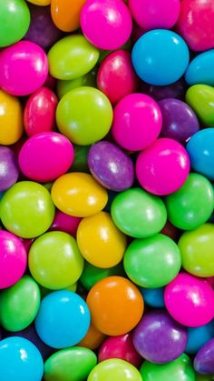 many different colored candies in a pile